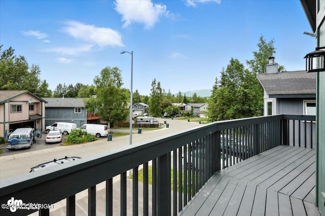 1928 Commodore Dr, Anchorage, AK 99507 - wooden deck featuring a residential view
