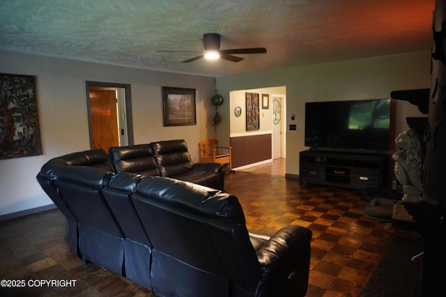2600 Birch St, Seward, AK 99664 - living area with a ceiling fan and baseboards