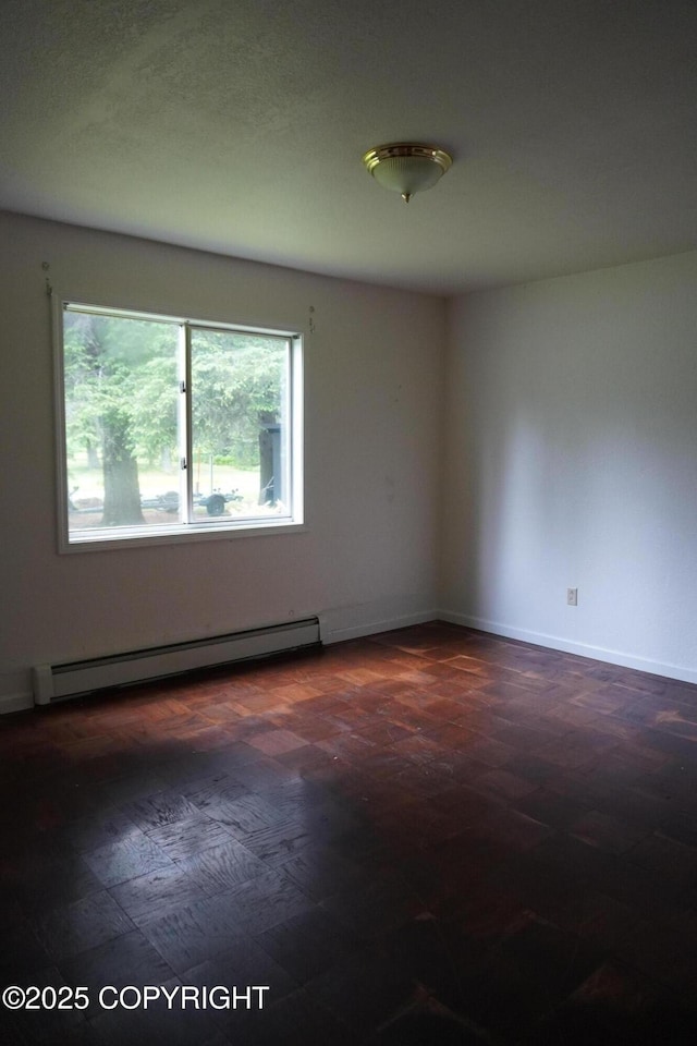 2600 Birch St, Seward, AK 99664 - empty room with baseboard heating and baseboards