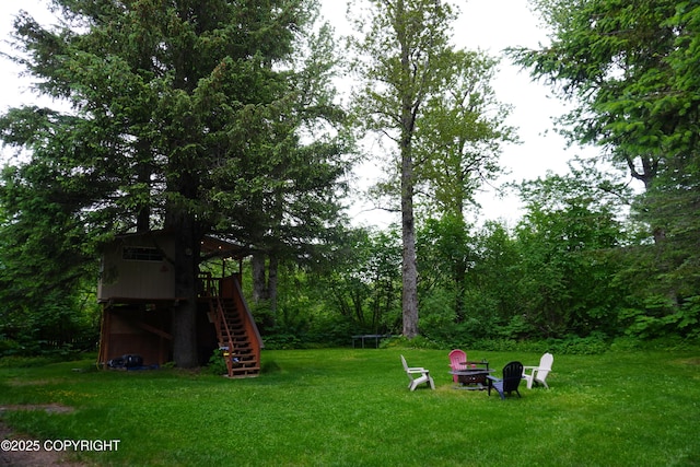 2600 Birch St, Seward, AK 99664 - view of green lawn with stairs and a fire pit