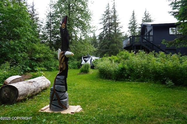 2600 Birch St, Seward, AK 99664 - view of green lawn with a wooden deck and stairs