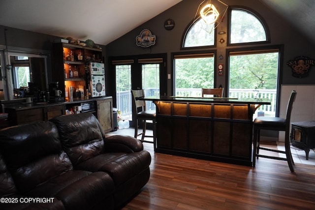 2600 Birch St, Seward, AK 99664 - living room featuring wood-type flooring, healthy amount of natural light, and high vaulted ceiling