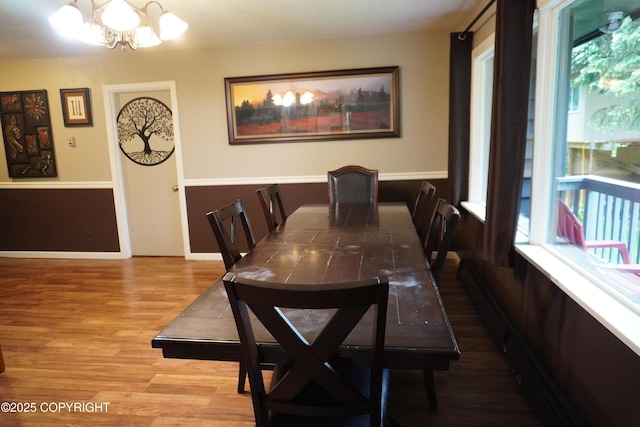 2600 Birch St, Seward, AK 99664 - dining room with a chandelier, wood finished floors, and healthy amount of natural light