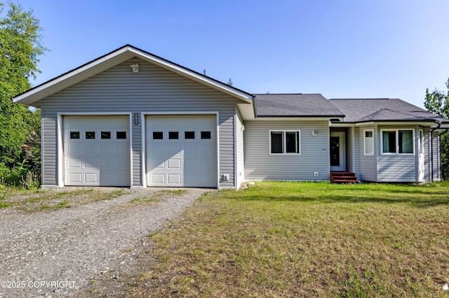 9700 E Strand Dr, Palmer, AK 99645 - ranch-style house featuring a front lawn, entry steps, an attached garage, and roof with shingles