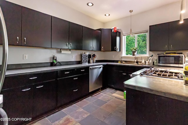 9700 E Strand Dr, Palmer, AK 99645 - kitchen featuring appliances with stainless steel finishes, recessed lighting, and hanging light fixtures