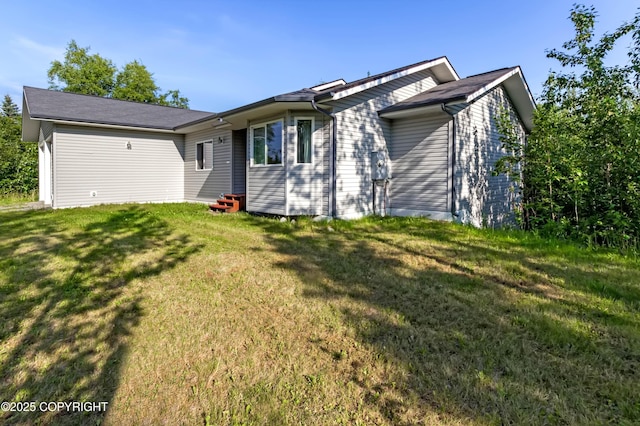 9700 E Strand Dr, Palmer, AK 99645 - view of front facade featuring a front yard, entry steps, and a garage