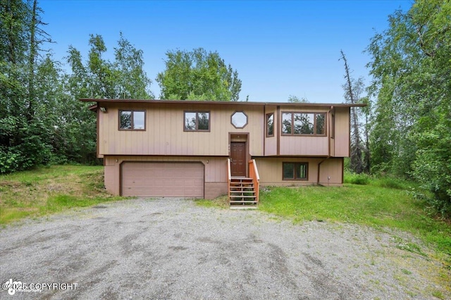 840 N Voss Cir, Wasilla, AK 99623 - raised ranch featuring an attached garage and driveway