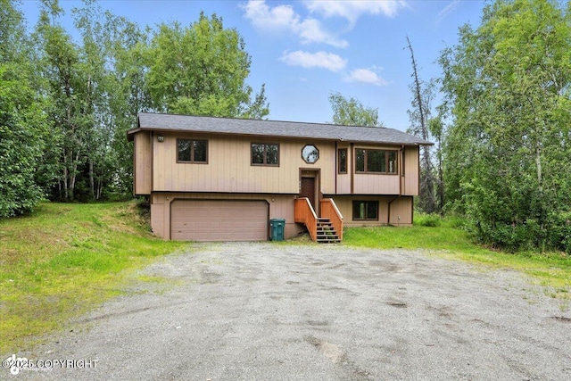 840 N Voss Cir, Wasilla, AK 99623 - split foyer home featuring an attached garage and driveway