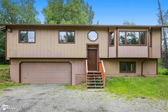 840 N Voss Cir, Wasilla, AK 99623 - split foyer home with a garage, entry steps, and driveway