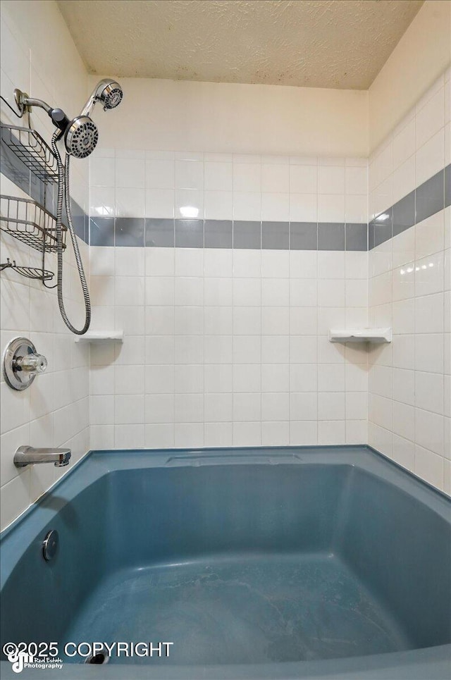 840 N Voss Cir, Wasilla, AK 99623 - full bath featuring tub / shower combination and a textured ceiling