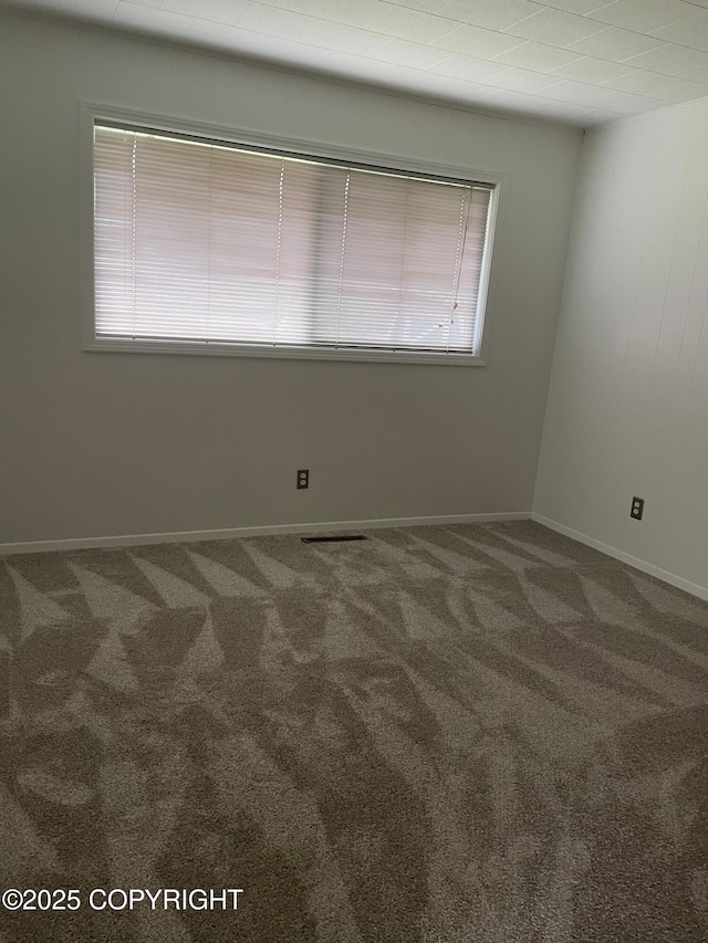 634 W 18th Ave, Anchorage, AK 99503 - carpeted empty room with baseboards
