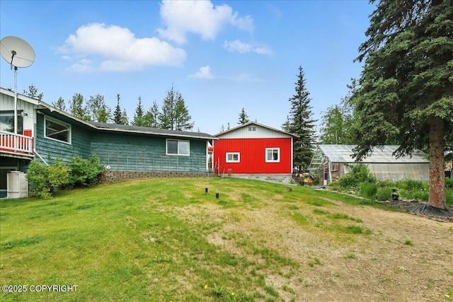 35485 Bluff Ct, Sterling, AK 99672 - view of grassy yard with an exterior structure and an outbuilding