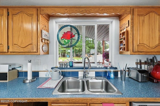 35485 Bluff Ct, Sterling, AK 99672 - kitchen with brown cabinetry and dark countertops