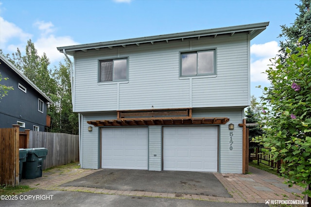 5170 Merle Cir, Anchorage, AK 99507 - back of house with a garage