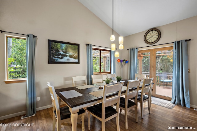 5170 Merle Cir, Anchorage, AK 99507 - dining area with wood finished floors, high vaulted ceiling, and french doors