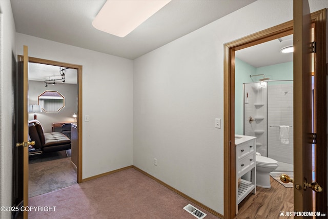 5170 Merle Cir, Anchorage, AK 99507 - hallway with light carpet and baseboards