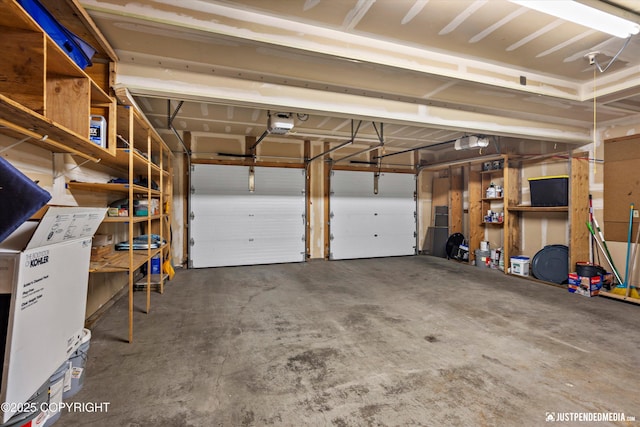 5170 Merle Cir, Anchorage, AK 99507 - garage featuring a garage door opener