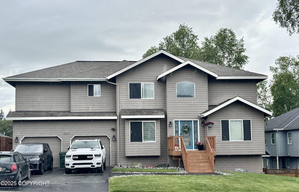 13600 Vasili Dr, Eagle River, AK 99577 - view of front of property featuring a front yard, driveway, and an attached garage