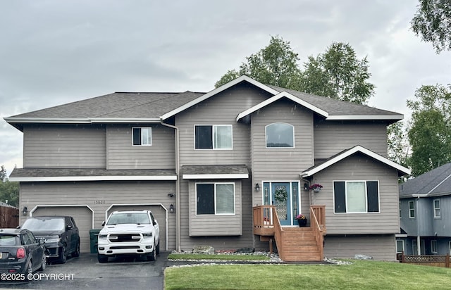 13600 Vasili Dr, Eagle River, AK 99577 - view of front of property featuring a front yard, driveway, and an attached garage