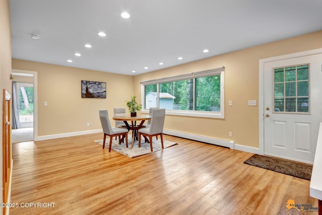 9601 Carlson Rd, Anchorage, AK 99507 - dining space with a baseboard heating unit, light wood-type flooring, and recessed lighting