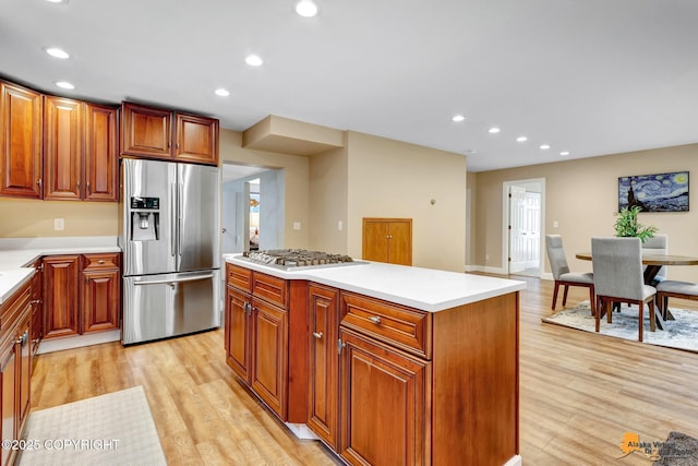9601 Carlson Rd, Anchorage, AK 99507 - kitchen featuring stainless steel appliances, recessed lighting, light wood finished floors, and light countertops