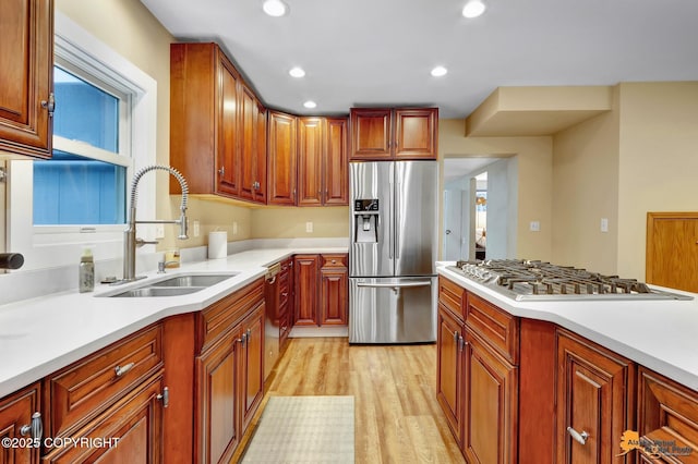 9601 Carlson Rd, Anchorage, AK 99507 - kitchen with stainless steel appliances, light wood-type flooring, light countertops, and recessed lighting