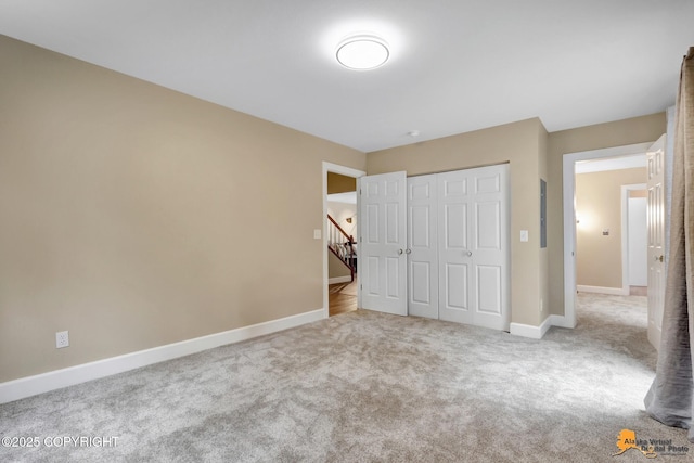 9601 Carlson Rd, Anchorage, AK 99507 - unfurnished bedroom with carpet floors and a closet