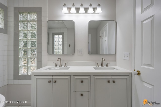9601 Carlson Rd, Anchorage, AK 99507 - bathroom with plenty of natural light, double vanity, and a shower
