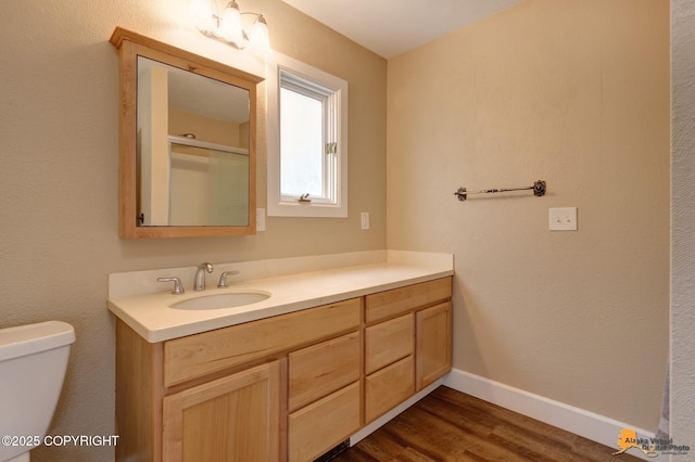 9601 Carlson Rd, Anchorage, AK 99507 - bathroom with vanity and wood finished floors
