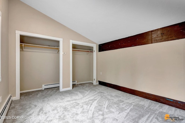 9601 Carlson Rd, Anchorage, AK 99507 - unfurnished bedroom featuring baseboard heating, multiple closets, lofted ceiling, and carpet
