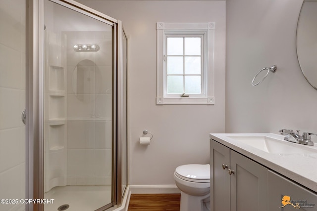 9601 Carlson Rd, Anchorage, AK 99507 - bathroom featuring a stall shower, vanity, and wood finished floors