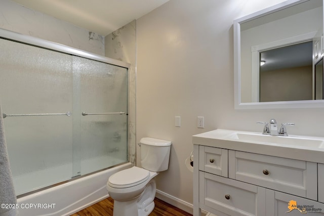 9601 Carlson Rd, Anchorage, AK 99507 - bathroom featuring wood finished floors, vanity, and combined bath / shower with glass door