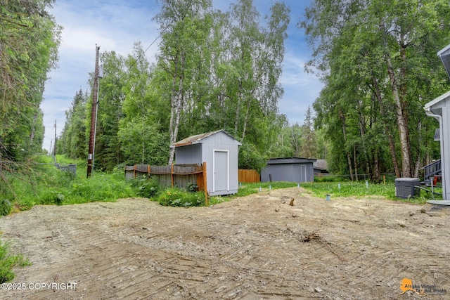 9601 Carlson Rd, Anchorage, AK 99507 - view of yard featuring a storage shed
