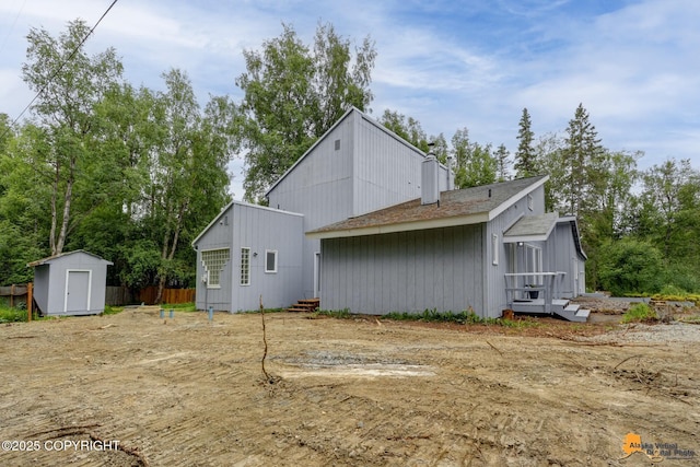 9601 Carlson Rd, Anchorage, AK 99507 - back of property featuring a storage unit