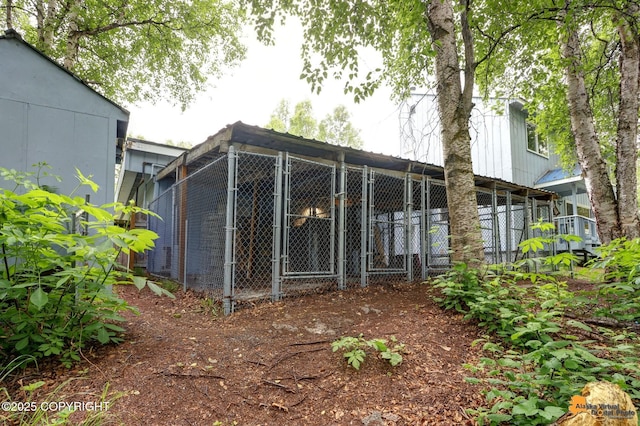 9601 Carlson Rd, Anchorage, AK 99507 - rear view of property featuring an outbuilding