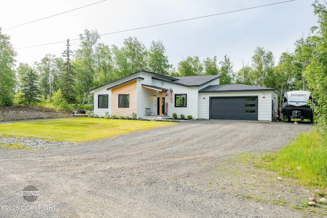 3200 E Woodruff Loop, Wasilla, AK 99654 - view of front of home featuring a garage, driveway, and a front lawn