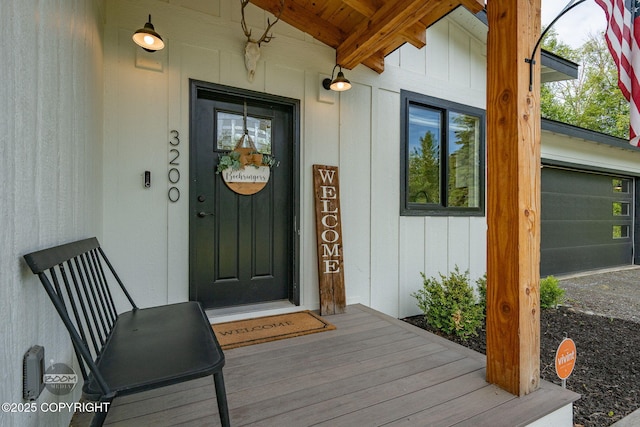 3200 E Woodruff Loop, Wasilla, AK 99654 - view of exterior entry with board and batten siding and an attached garage