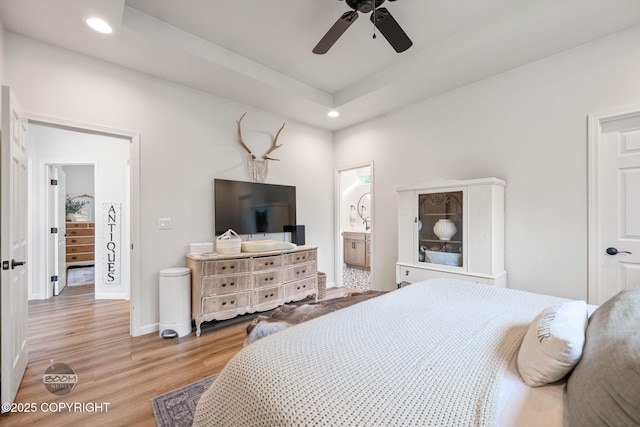 3200 E Woodruff Loop, Wasilla, AK 99654 - bedroom featuring recessed lighting, wood finished floors, ensuite bathroom, a raised ceiling, and ceiling fan