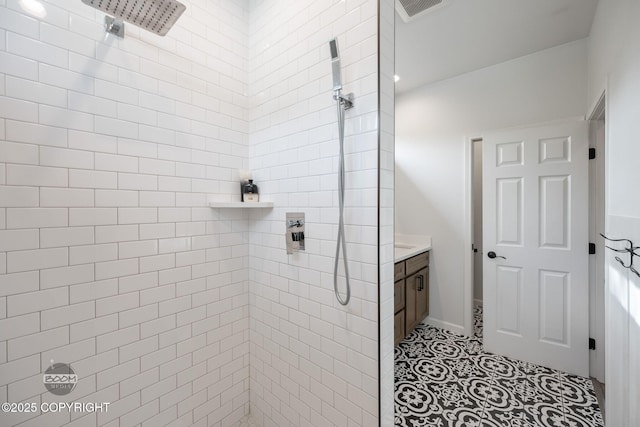 3200 E Woodruff Loop, Wasilla, AK 99654 - bathroom with a tile shower, vanity, and tile patterned floors