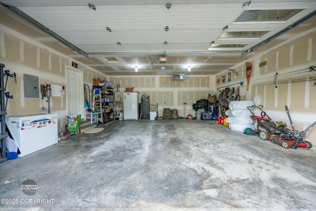 3200 E Woodruff Loop, Wasilla, AK 99654 - garage featuring electric panel, a garage door opener, and freestanding refrigerator