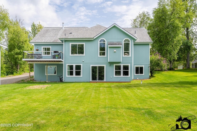 4228 E Serendipity Loop, Wasilla, AK 99654 - rear view of house with a lawn and roof with shingles