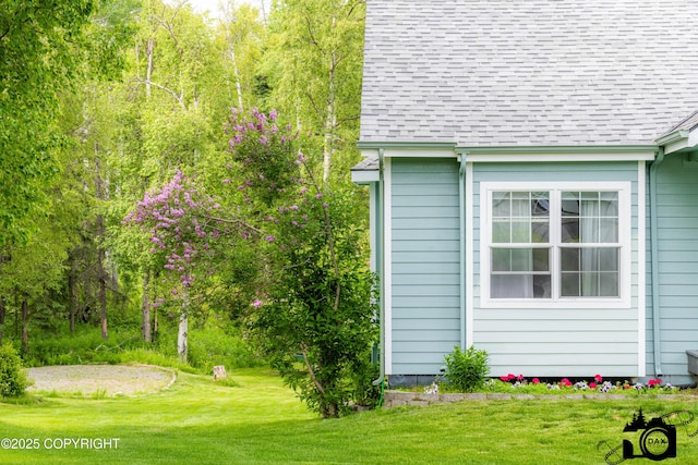 4228 E Serendipity Loop, Wasilla, AK 99654 - view of side of property featuring roof with shingles and a lawn