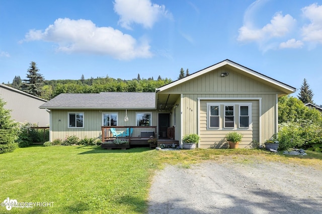 196 W Fairview Ave, Homer, AK 99603 - view of front of house featuring a wooden deck and a front yard