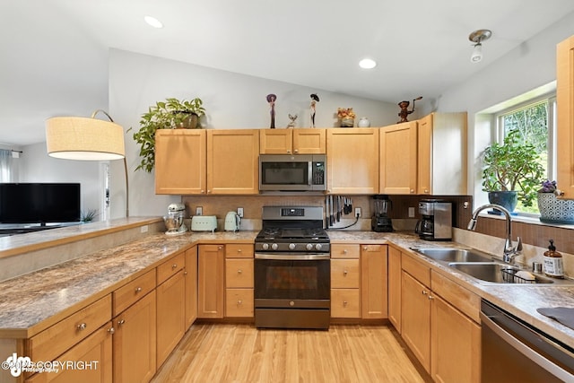 196 W Fairview Ave, Homer, AK 99603 - kitchen with appliances with stainless steel finishes, light wood-style flooring, a peninsula, and light brown cabinets