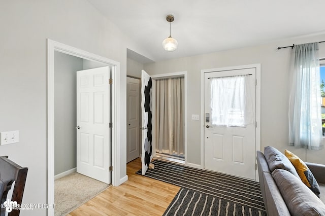 196 W Fairview Ave, Homer, AK 99603 - entrance foyer featuring light wood-type flooring and baseboards