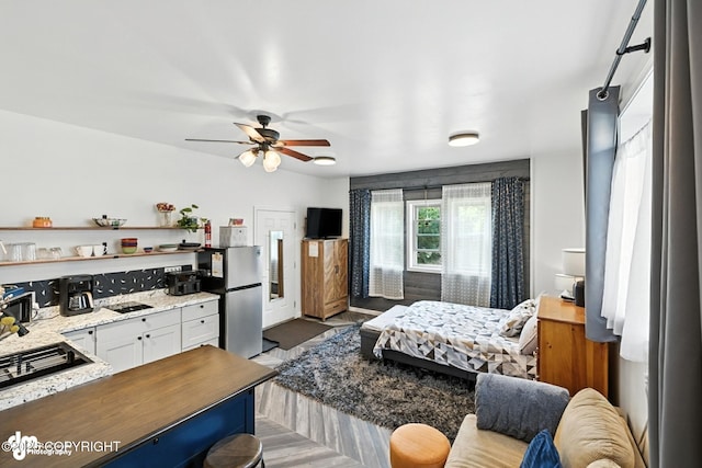 196 W Fairview Ave, Homer, AK 99603 - bedroom featuring freestanding refrigerator and ceiling fan