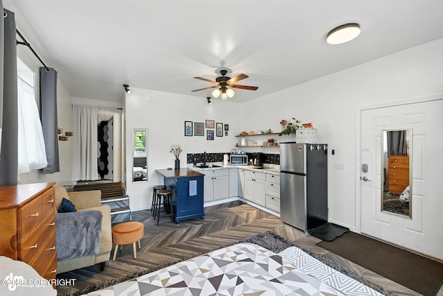 196 W Fairview Ave, Homer, AK 99603 - bedroom featuring freestanding refrigerator and a sink