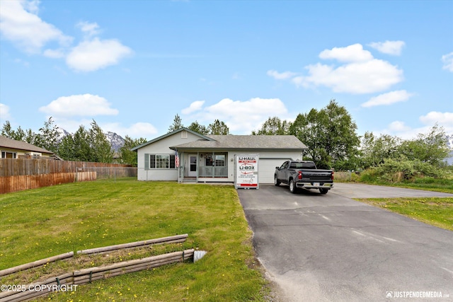 13693 E Guernsey Ln, Palmer, AK 99645 - view of front facade with an attached garage and driveway