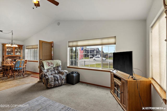 13693 E Guernsey Ln, Palmer, AK 99645 - living area featuring vaulted ceiling, ceiling fan, carpet, and a chandelier
