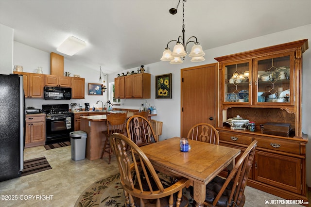 13693 E Guernsey Ln, Palmer, AK 99645 - dining space with lofted ceiling, a chandelier, and light flooring